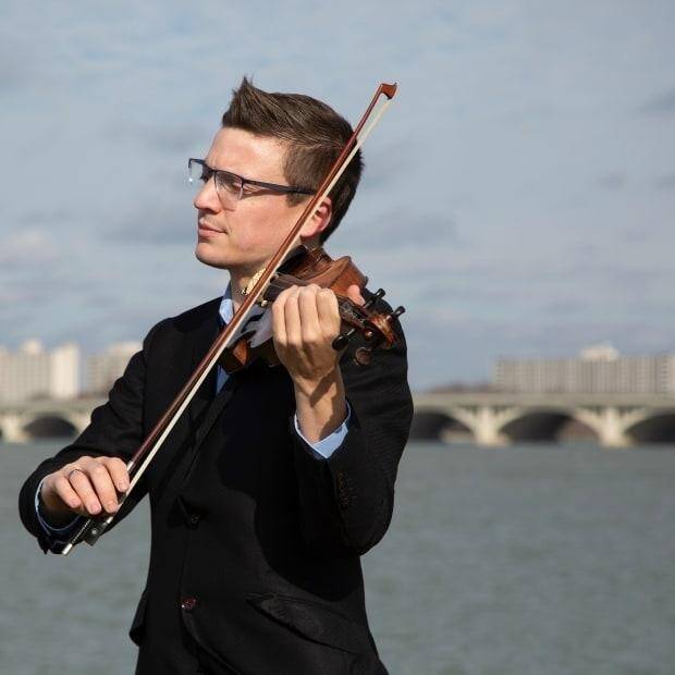 A person playing a violin
AI-generated content may be incorrect.